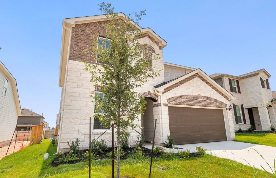 Front exterior of a new home in Patterson Ranch, Georgetown, TX, highlighting curb appeal (Image 22).