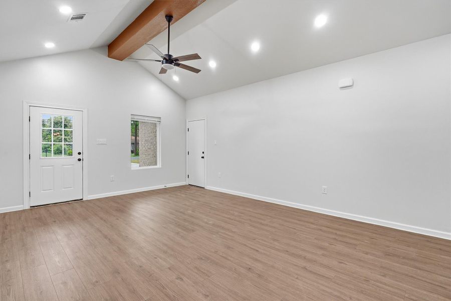 Living room area, exposed beam and updated ceiling fan