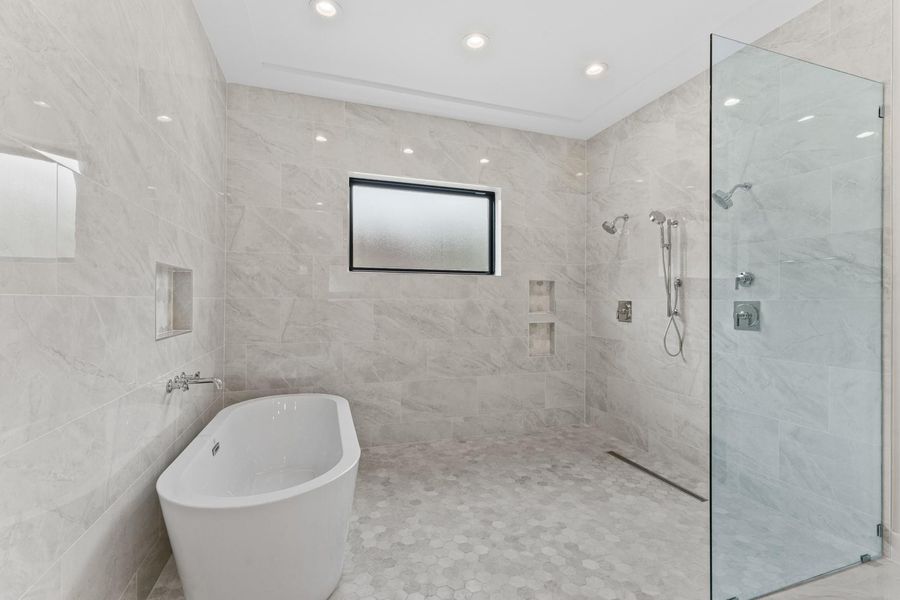Large wet room with soaking tub and dual showers