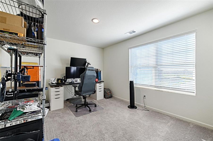 Home office with light carpet and recessed lighting Home office with light carpet and recessed lighting