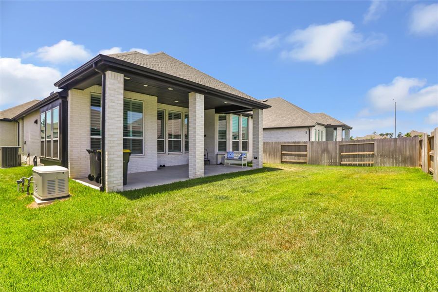 Exterior details and patio area of a home in Grand Central Park, Conroe (Image 29).