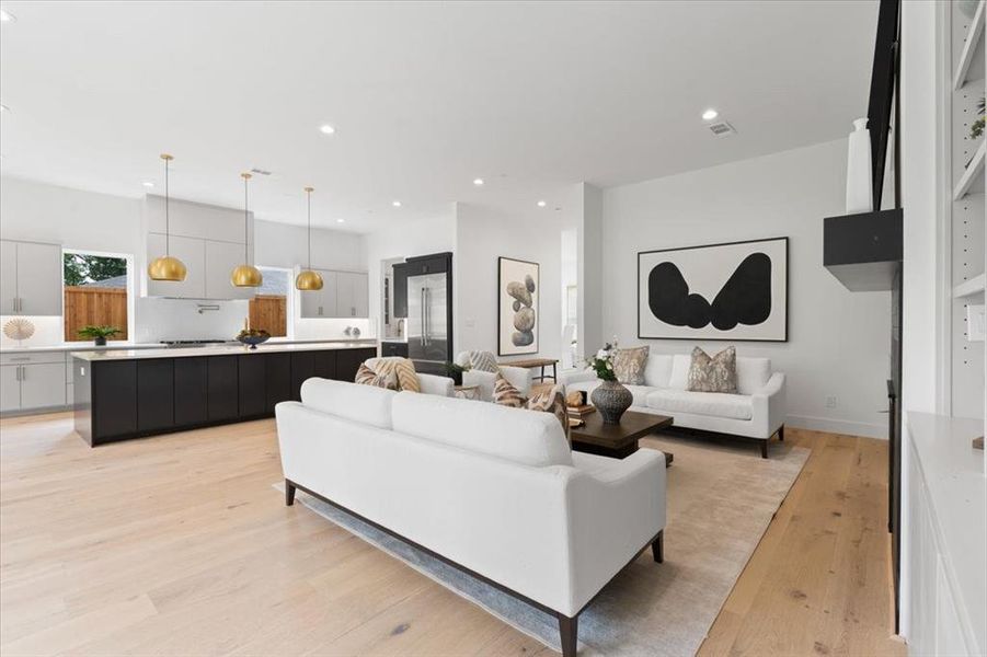 Living room with light hardwood / wood-style floors