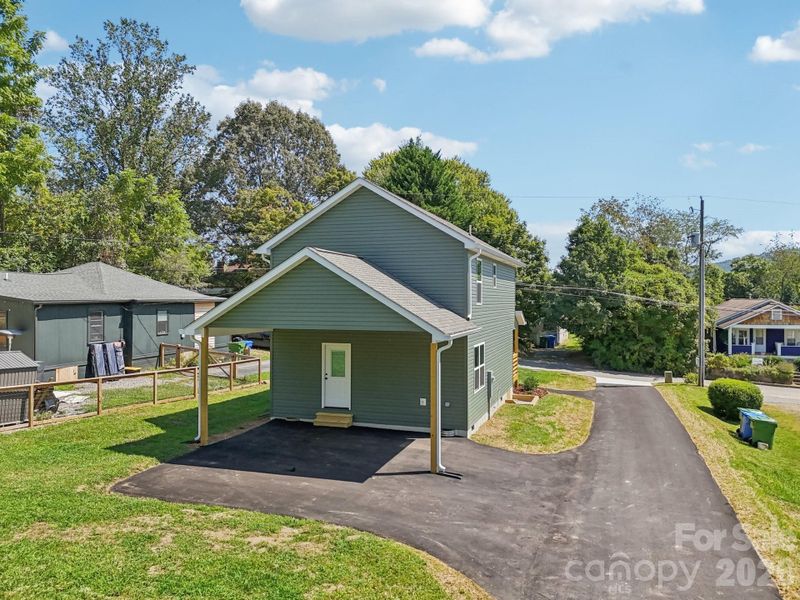 Back yard with carport and additional parking space