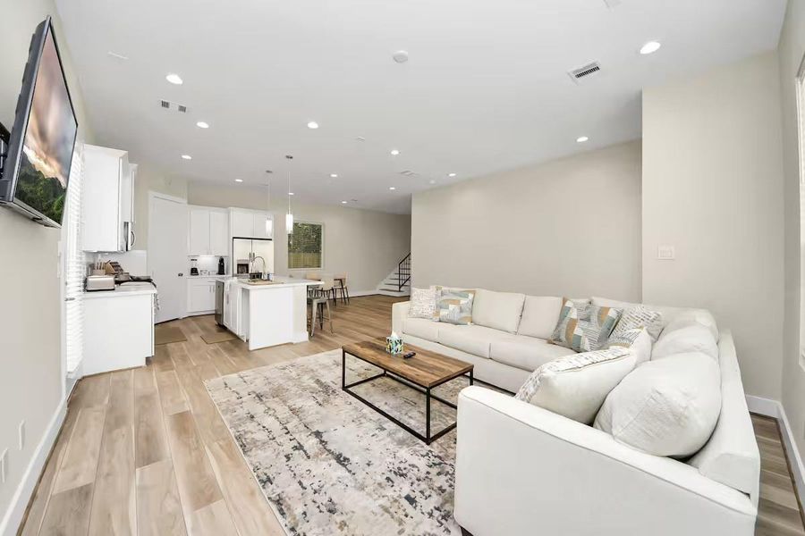A spacious living area gives you flexibility with furniture placement while keeping the kitchen and dining spaces within easy reach.