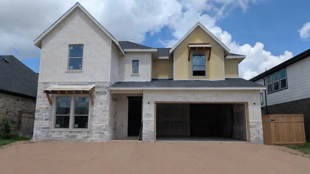 Front exterior of a new home in , Missouri City, TX, highlighting curb appeal (Image 1). Front exterior of a new home in , Missouri City, TX, highlighting curb appeal (Image 1).