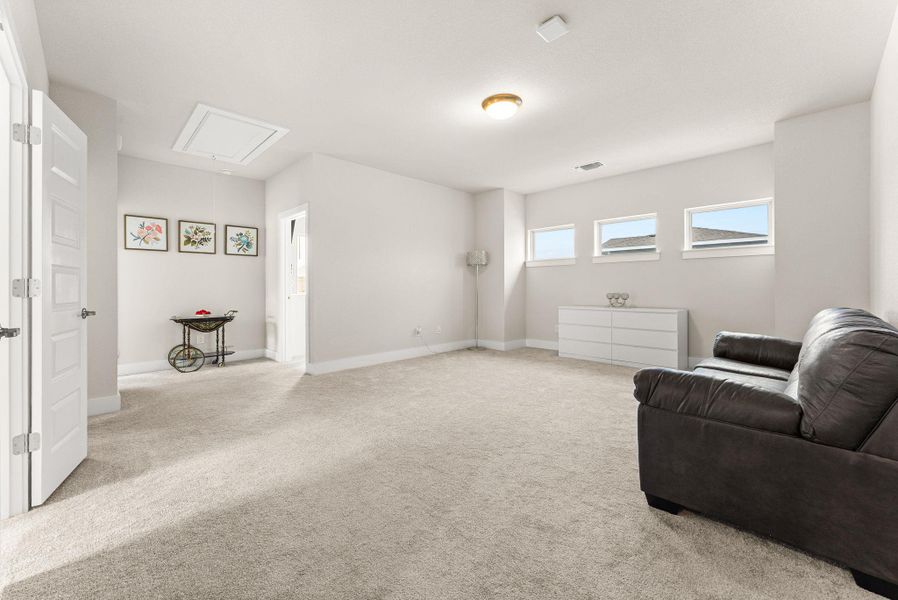 The large game room is the focal point of the second floor.