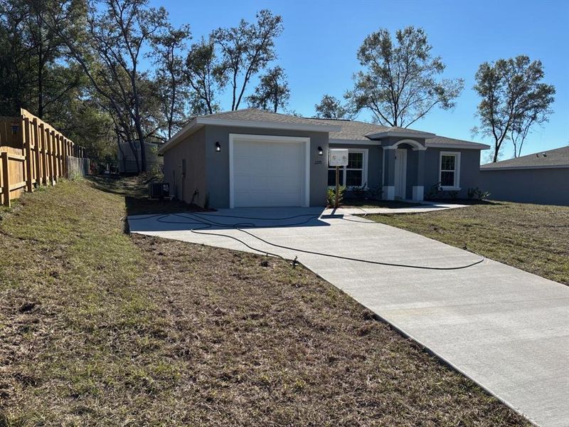 Front exterior of a new home in , Citrus Springs, FL, highlighting curb appeal (Image 1). Front exterior of a new home in , Citrus Springs, FL, highlighting curb appeal (Image 1).