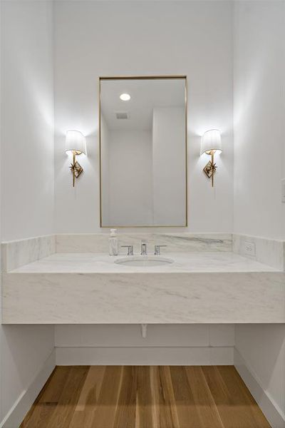 Half bath near just off the foyer & away from the main living area.