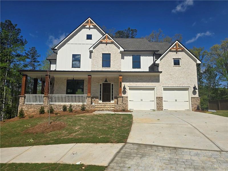 Front exterior of a new home in Palmer Falls, Douglasville, GA, highlighting curb appeal (Image 2).