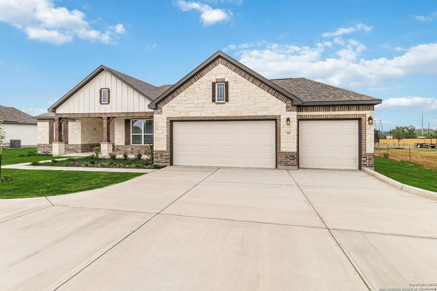 Front exterior of a new home in Lonesome Dove, San Antonio, TX, highlighting curb appeal (Image 24).