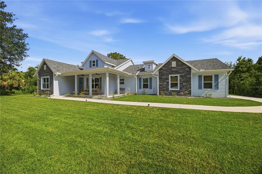 Front exterior of a new home in , Wesley Chapel, FL, highlighting curb appeal (Image 28). Front exterior of a new home in , Wesley Chapel, FL, highlighting curb appeal (Image 28).