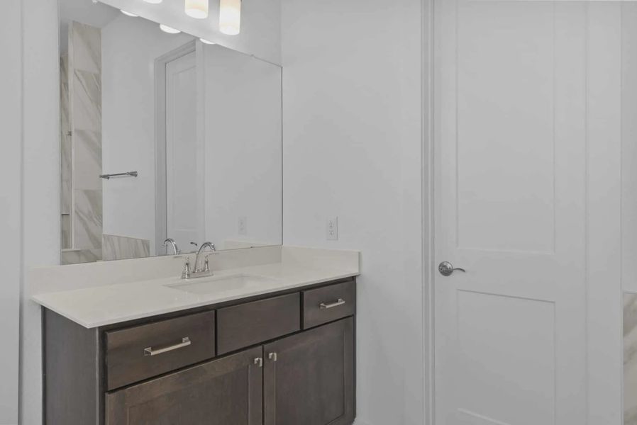 Representative furnished interior of a home built from the Nicklaus by Chesmar Homes in Riceland Alley Loads, Mont Belvieu (Image 45).