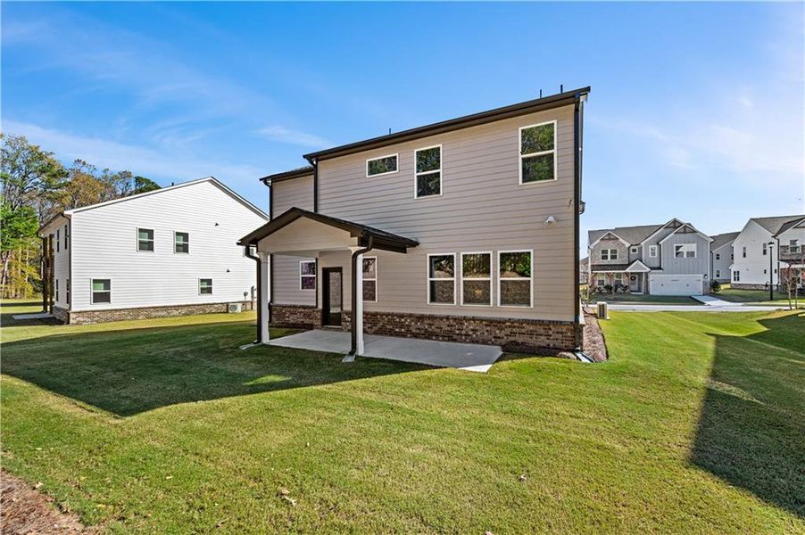 Exterior details and patio area of a home in The Paddocks at Doc Hughes, Buford (Image 3).
