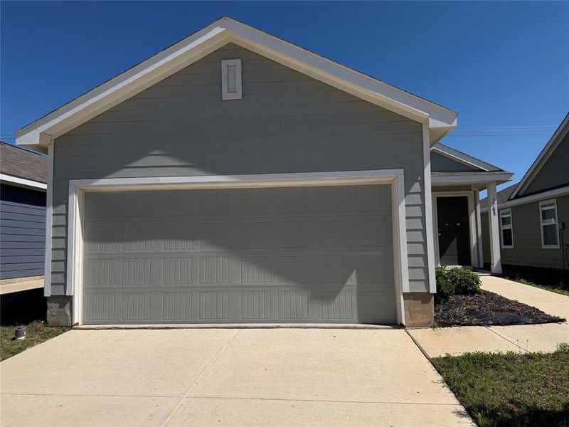Single-story residence featuring siding exterior, an attached garage, a concrete driveway, and a covered entry Single-story residence featuring siding exterior, an attached garage, a concrete driveway, and a covered entry