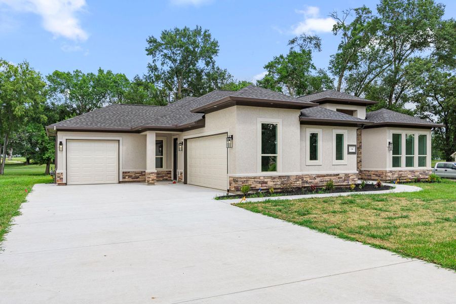 Front exterior of a new home in , Hempstead, TX, highlighting curb appeal (Image 25). Front exterior of a new home in , Hempstead, TX, highlighting curb appeal (Image 25).