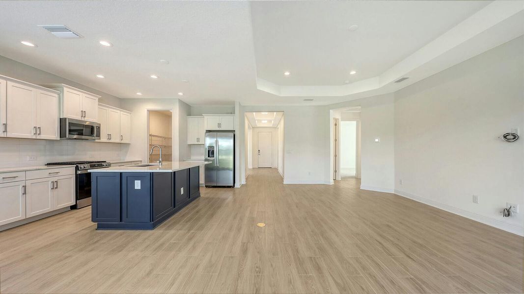 Furnished interior view inside a new home in Palm Grove Real Estate and Homes for Sale in Lakewood Ranch, FL - Neal Communities, Lakewood Ranch (Image 7).