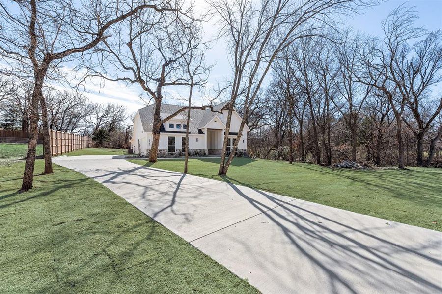Front exterior of a new home in , Azle, TX, highlighting curb appeal (Image 1). Front exterior of a new home in , Azle, TX, highlighting curb appeal (Image 1).