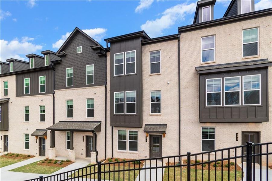 Front exterior of a new home in Daybreak, Newnan, GA, highlighting curb appeal (Image 1).