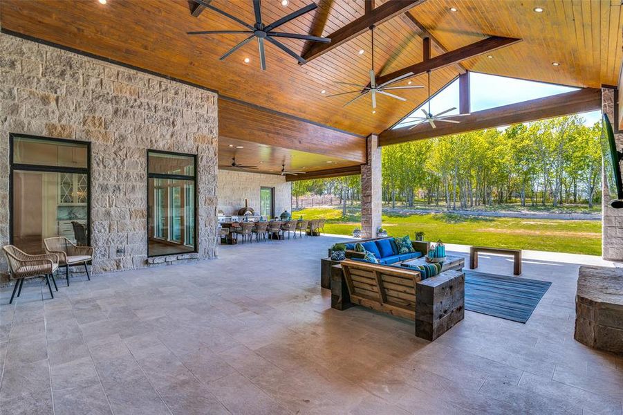 View of patio featuring outdoor lounge area and ceiling fan