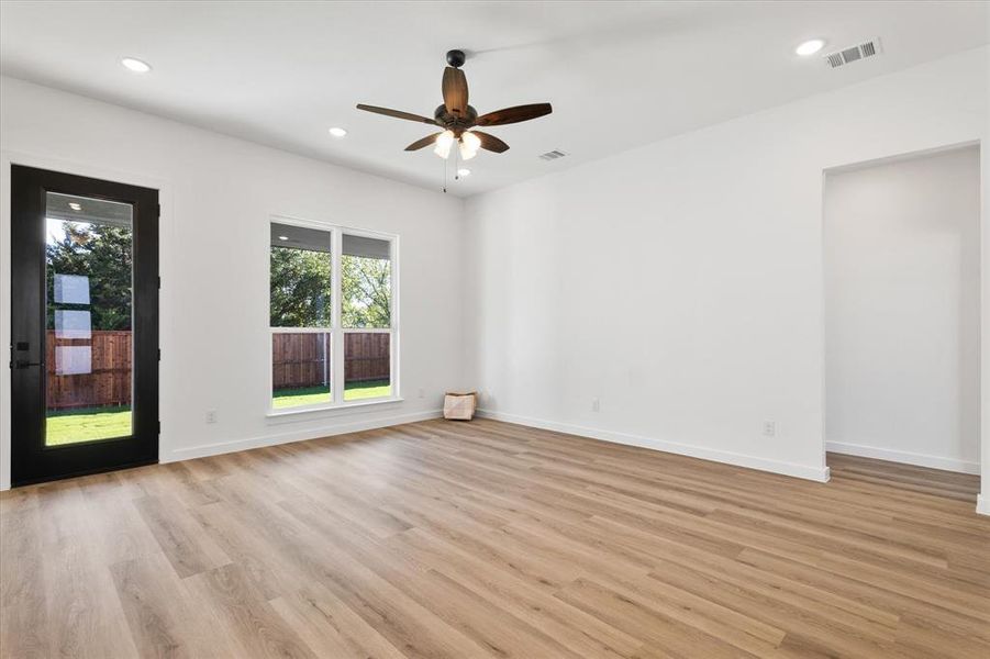 Spare room with ceiling fan and light hardwood / wood-style flooring
