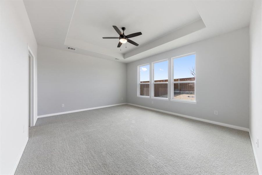 With high ceilings, oversized windows and plush carpeting, this owner's suite was designed for rest and relaxation.