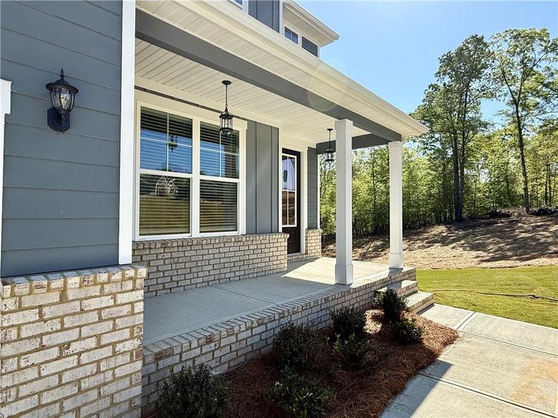 Exterior details and patio area of a home in Waters Edge, Mansfield (Image 3).