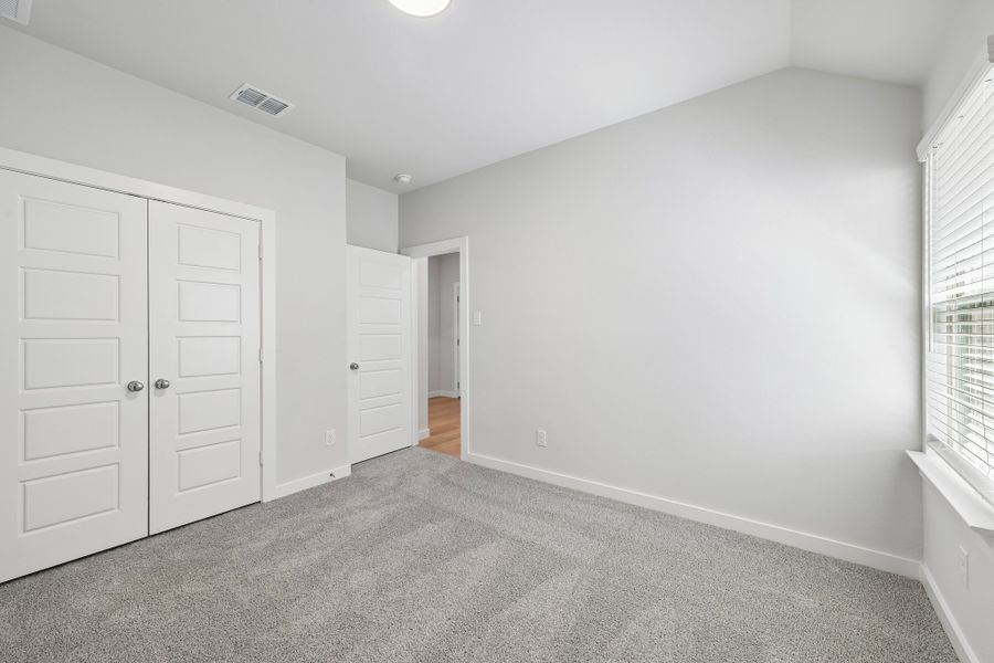 Bedroom in the Heisman home plan by Trophy Signature Homes Bedroom in the Heisman home plan by Trophy Signature Homes