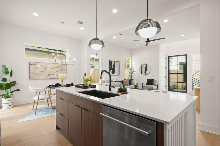 A contemporary open-concept layout unites the kitchen, dining area, and living space for effortless entertaining. A contemporary open-concept layout unites the kitchen, dining area, and living space for effortless entertaining.