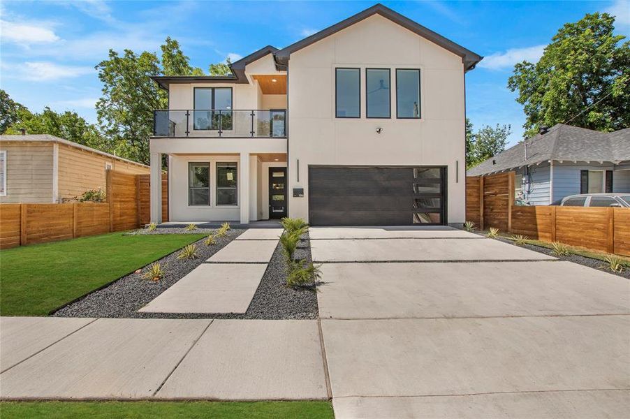 Contemporary house with a balcony and a garage