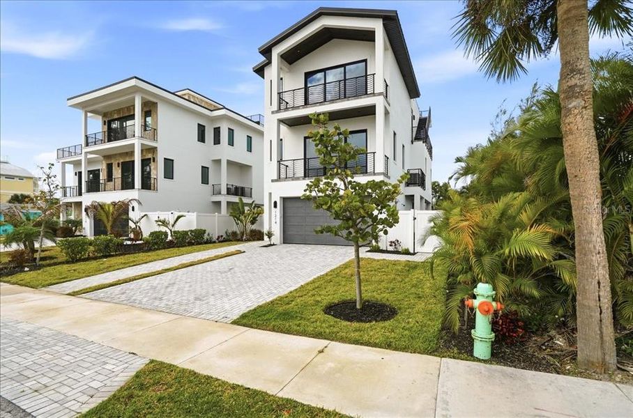 Front exterior of a new home in , Englewood, FL, highlighting curb appeal (Image 27).