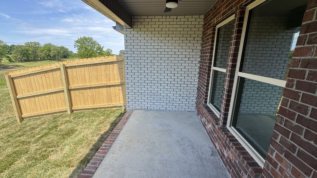 Exterior details and patio area of a home in The Greens at Legacy Townhomes, Springfield (Image 3).