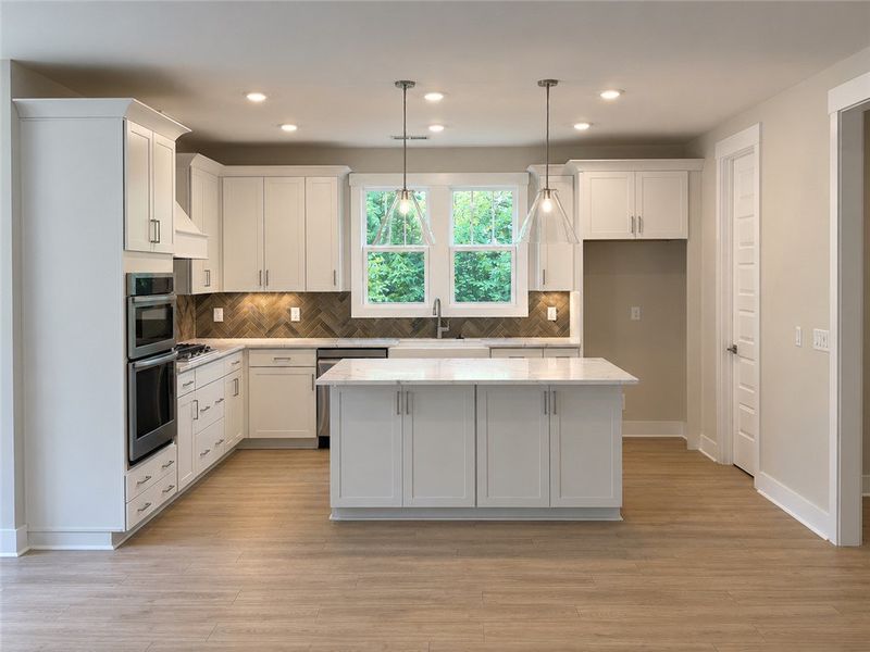Culinary delights await in this bright kitchen wit Culinary delights await in this bright kitchen wit