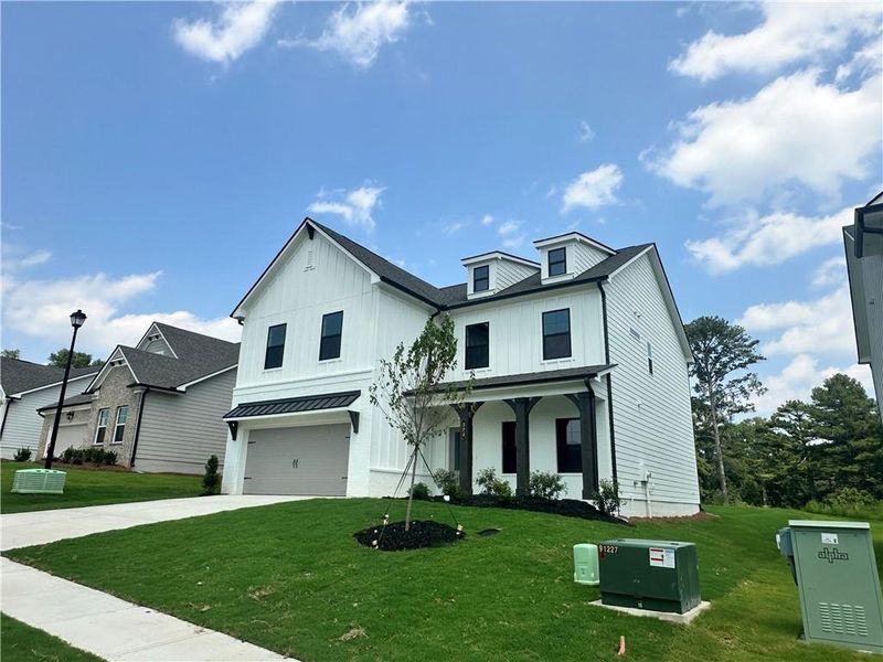 Front exterior of a new home in Summerlin, Winder, GA, highlighting curb appeal (Image 22). Front exterior of a new home in Summerlin, Winder, GA, highlighting curb appeal (Image 22).