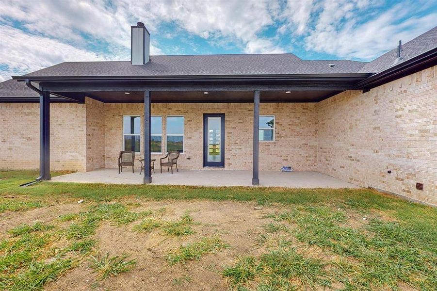 Back of house with a patio area