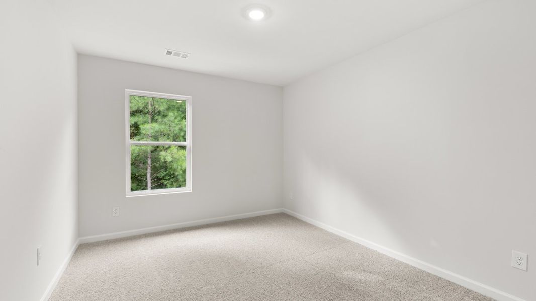 Representative unfurnished interior of a home built from the Salisbury by D.R. Horton in Waypoint, Flowery Branch (Image 26).