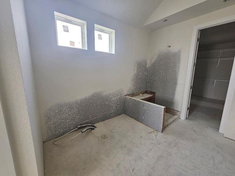 Bathroom featuring lofted ceiling Bathroom featuring lofted ceiling