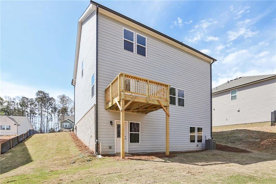 Exterior details and patio area of a home in The Pointe at Heron Bay, Locust Grove (Image 18).