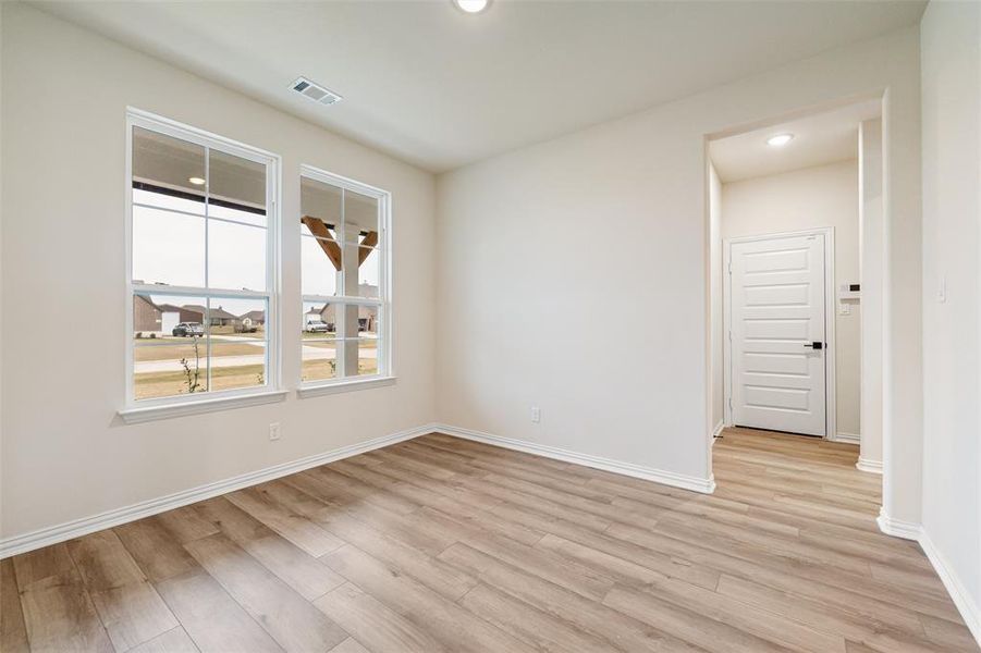 Unfurnished room with light wood-style flooring and recessed lighting
