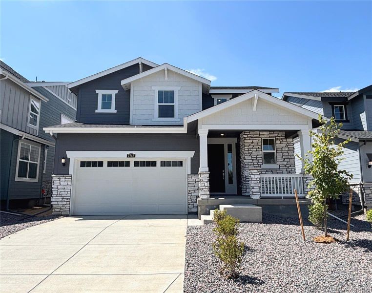 Front exterior of a new home in Vermilion Creek: The Pioneer Collection, Centennial, CO, highlighting curb appeal (Image 12).