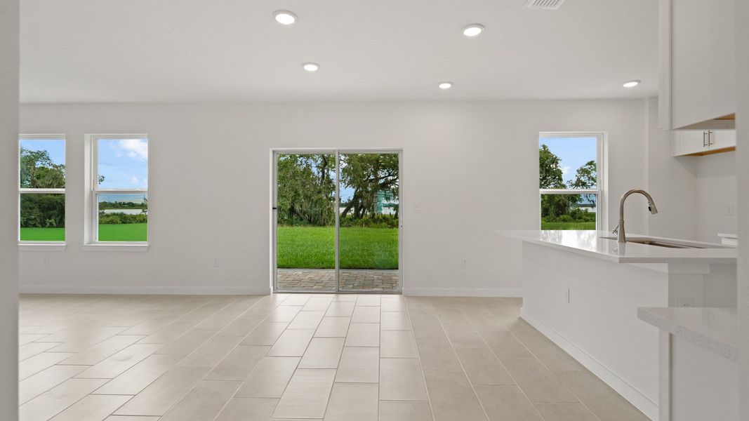 Highbourne Kitchen and Living Area by DRB Homes in Willowbrook North located in Winter Haven, FL. Highbourne Kitchen and Living Area by DRB Homes in Willowbrook North located in Winter Haven, FL.