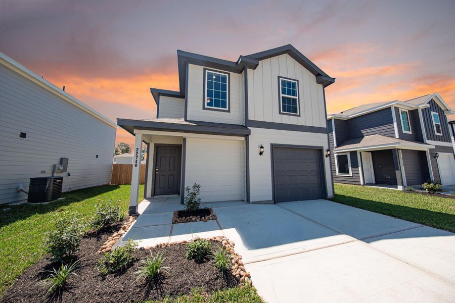 Front exterior of a new home in Townsend Reserve, Splendora, TX, highlighting curb appeal (Image 12). Front exterior of a new home in Townsend Reserve, Splendora, TX, highlighting curb appeal (Image 12).