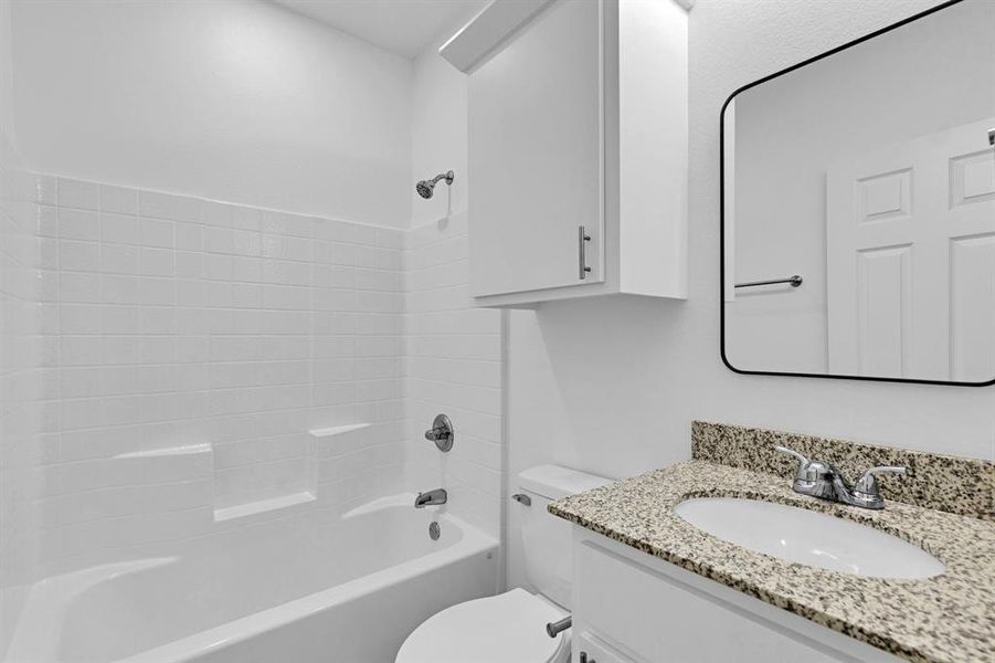 Full bathroom featuring vanity and shower / washtub combination Full bathroom featuring vanity and shower / washtub combination