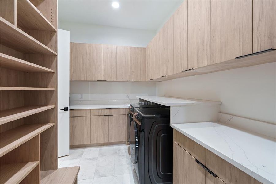 Laundry/Mud Room with cabinet storage and space separate full size washer and dryer