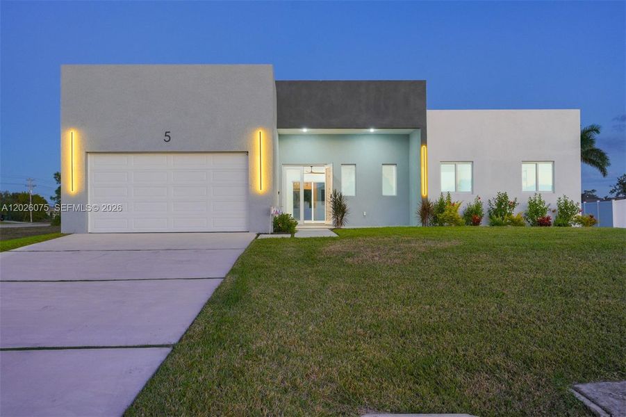 Front exterior of a new home in , Cape Coral, FL, highlighting curb appeal (Image 21).