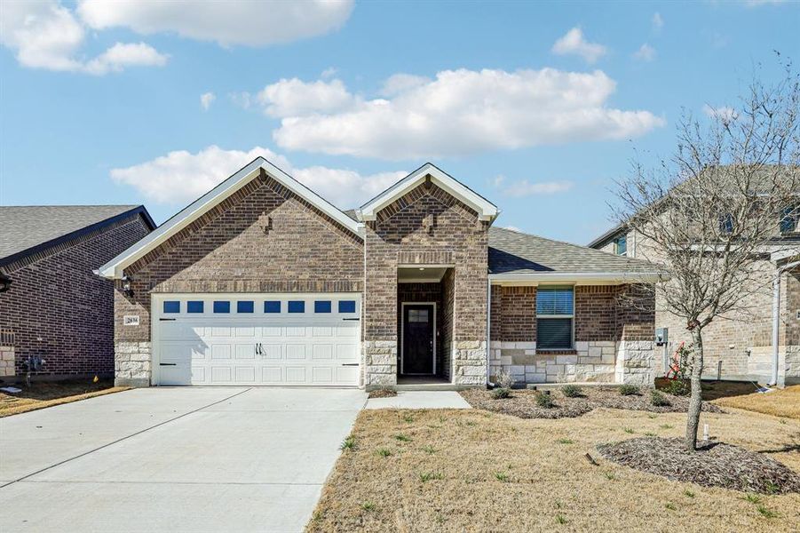 Front exterior of a new home in Parks at Foster Crossing - Signature Series, Anna, TX, highlighting curb appeal (Image 1). Front exterior of a new home in Parks at Foster Crossing - Signature Series, Anna, TX, highlighting curb appeal (Image 1).