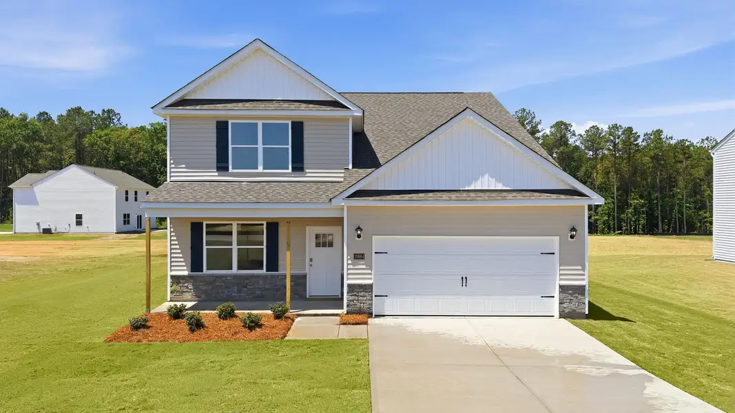 Front exterior of a new home in Beaver Dam Crossing, Bailey, NC, highlighting curb appeal (Image 2). Front exterior of a new home in Beaver Dam Crossing, Bailey, NC, highlighting curb appeal (Image 2).