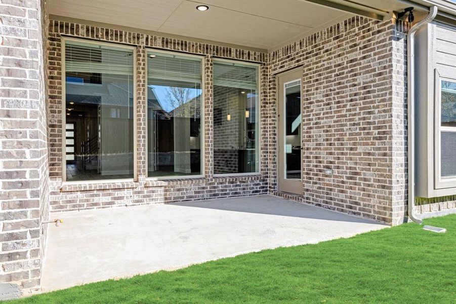 Exterior details and patio area of a home in Creekview Meadows, Pilot Point (Image 3).