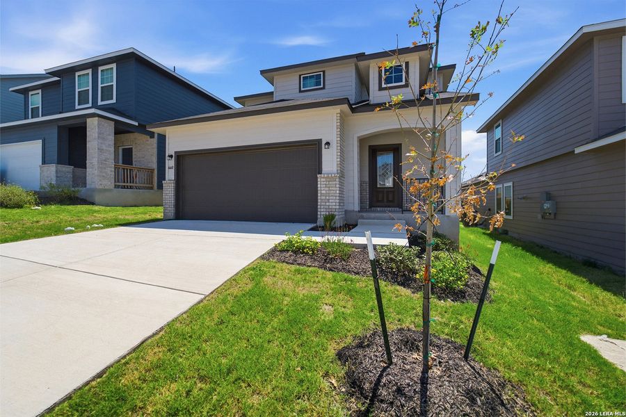 Front exterior of a new home in Willow View, Converse, TX, highlighting curb appeal (Image 2). Front exterior of a new home in Willow View, Converse, TX, highlighting curb appeal (Image 2).