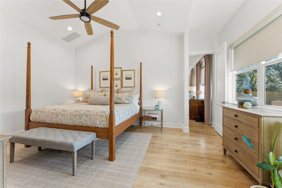 Bedroom with light wood-style flooring, a ceiling fan, recessed lighting, and lofted ceiling