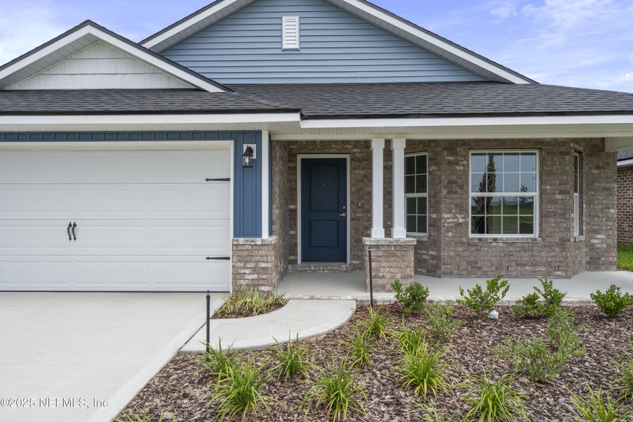 Front exterior of a new home in Shadow Crest at Rolling Hills, Green Cove Springs, FL, highlighting curb appeal (Image 16).